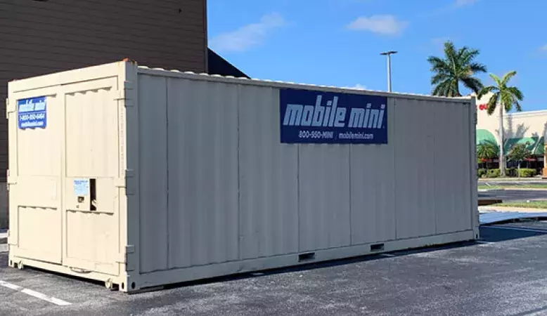 Mobile Mini storage unit standing alone outside of business